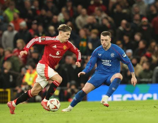 Alejandro Garnacho of Manchester United, ManU and Leon King of Rangers during the Europa League group phase match at Old Trafford, Manchester. Manchester United v Rangers, UEFA Europa League, Group Stage, Football, Old Trafford, Manchester, UK - 23 Jan 2025 EDITORIAL USE ONLY No use with unauthorised audio, video, data, fixture lists, club league logos or live services. Online in-match use limited to 120 images, no video emulation. No use in betting, games or single club league player publications. Copyright: xRangersxFC Shutterstockx 15111693ma