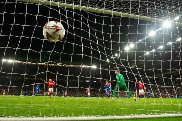 Cyriel Dessers of Rangers scores past Manchester United, ManU goalkeeper Altay Bayindir during the Europa League group phase match at Old Trafford, Manchester. Manchester United v Rangers, UEFA Europa League, Group Stage, Football, Old Trafford, Manchester, UK - 23 Jan 2025 EDITORIAL USE ONLY No use with unauthorised audio, video, data, fixture lists, club league logos or live services. Online in-match use limited to 120 images, no video emulation. No use in betting, games or single club league player publications. Copyright: xRangersxFC Shutterstockx 15111693lu