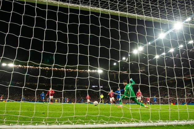 Cyriel Dessers of Rangers scores past Manchester United, ManU goalkeeper Altay Bayindir during the Europa League group phase match at Old Trafford, Manchester. Manchester United v Rangers, UEFA Europa League, Group Stage, Football, Old Trafford, Manchester, UK - 23 Jan 2025 EDITORIAL USE ONLY No use with unauthorised audio, video, data, fixture lists, club league logos or live services. Online in-match use limited to 120 images, no video emulation. No use in betting, games or single club league player publications. Copyright: xRangersxFC Shutterstockx 15111693ls