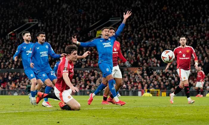 Manchester, England, 23rd January 2025. Harry Maguire of Manchester United, ManU (3L) has a header saved during the UEFA Europa League match at Old Trafford, Manchester. Picture credit should read: Andrew Yates Sportimage EDITORIAL USE ONLY. No use with unauthorised audio, video, data, fixture lists, club league logos or live services. Online in-match use limited to 120 images, no video emulation. No use in betting, games or single club league player publications. SPI_035_AY_MAN_UTD_RANGERS SPI-3616-0035