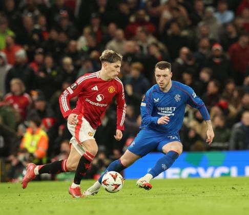 Alejandro Garnacho of Manchester United, ManU and Leon King of Rangers during the Europa League group phase match at Old Trafford, Manchester. Manchester United v Rangers, UEFA Europa League, Group Stage, Football, Old Trafford, Manchester, UK - 23 Jan 2025 EDITORIAL USE ONLY No use with unauthorised audio, video, data, fixture lists, club league logos or live services. Online in-match use limited to 120 images, no video emulation. No use in betting, games or single club league player publications. Copyright: xRangersxFC Shutterstockx 15111693my