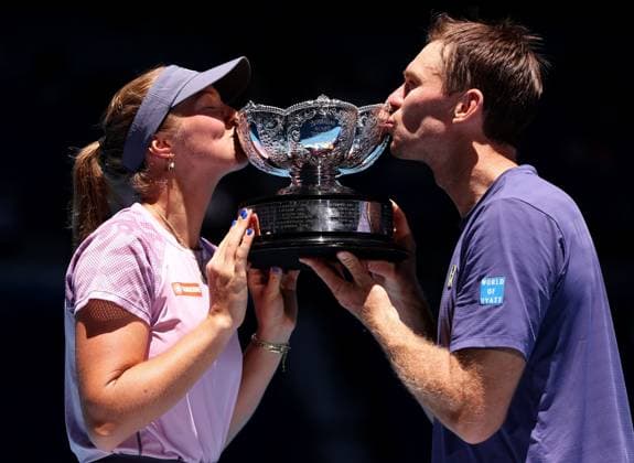Olivia Gadecki and John Peers of Australia kiss the mixed doubles trophy Australian Open, Day Thirteen, Tennis, Melbourne Park, Melbourne, Australia - 24 Jan 2025  Copyright: xEllaxLing Shutterstockx 15108785a