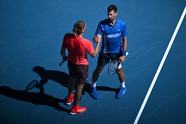TENNIS AUSTRALIAN OPEN, Novak Djokovic of Serbia (right) shakes hands with Alexander Zverev of Germany after retiring and loosing the first set, during his semi-final match during the 2025 Australian Open at Melbourne Park in Melbourne, Friday, January 24, 2025. ( NO ARCHIVING, EDITORIAL USE ONLY, NO USE IN BOOKS WITHOUT CONSENT MELBOURNE VICTORIA AUSTRALIA  Copyright: xJOELxCARRETTx 20250124181673281869