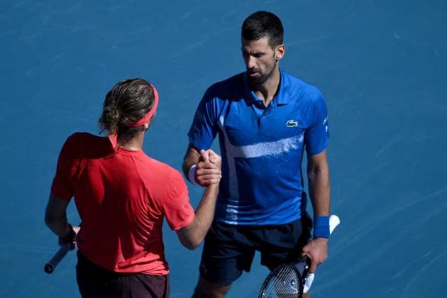 TENNIS AUSTRALIAN OPEN, Novak Djokovic of Serbia (right) shakes hands with Alexander Zverev of Germany after retiring and loosing the first set, during his semi-final match during the 2025 Australian Open at Melbourne Park in Melbourne, Friday, January 24, 2025. ( NO ARCHIVING, EDITORIAL USE ONLY, NO USE IN BOOKS WITHOUT CONSENT MELBOURNE VICTORIA AUSTRALIA  Copyright: xJOELxCARRETTx 20250124199135564988