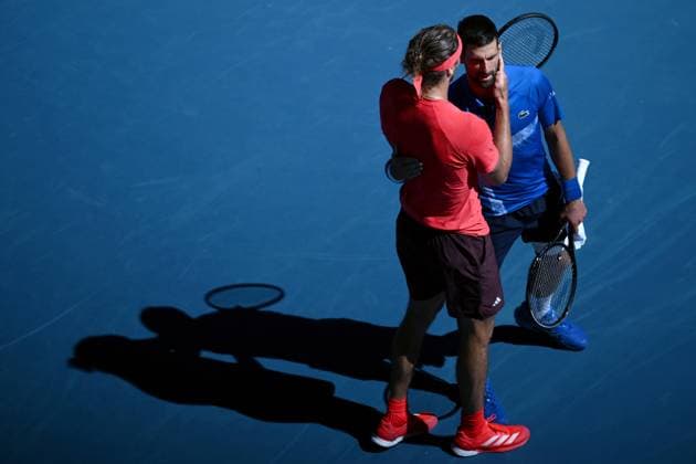 TENNIS AUSTRALIAN OPEN, Novak Djokovic of Serbia (right) shakes hands with Alexander Zverev of Germany after retiring and loosing the first set, during his semi-final match during the 2025 Australian Open at Melbourne Park in Melbourne, Friday, January 24, 2025. ( NO ARCHIVING, EDITORIAL USE ONLY, NO USE IN BOOKS WITHOUT CONSENT MELBOURNE VICTORIA Australia  Copyright: xJOELxCARRETTx 20250124119501851320