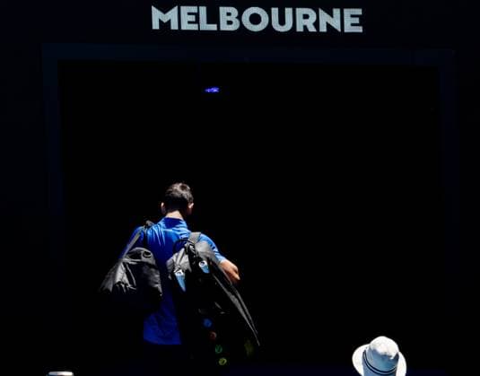 (250124) -- MELBOURNE, Jan. 24, 2025 -- Novak Djokovic leaves the court after retiring from the men s singles semifinals between Novak Djokovic of Serbia and Alexander Zverev of Germany at Australian Open tennis tournament in Melbourne, Australia, Jan. 24, 2025. (Photo by Xinhua) (SP)AUSTRALIA-MELBOURNE-TENNIS-AUSTRALIAN OPEN-MEN S SINGLES-SEMIFINALS HuxJingchen 