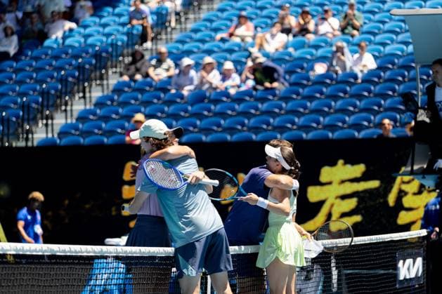 (250124) -- MELBOURNE, Jan. 24, 2025 -- Olivia Gadecki (1st L) John Peers (3rd L) of Australia and their compatriots Kimberly Birrell (1st R) John-Patrick Smith hug after their mixed doubles final at Australian Open tennis tournament in Melbourne, Australia, Jan. 24, 2025. (Photo by Xinhua) (SP)AUSTRALIA-MELBOURNE-TENNIS-AUSTRALIAN OPEN-MIXED DOUBLES-FINALS HuxJingchen 