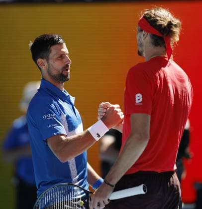 Tennis: Australian Open Novak Djokovic (L) of Serbia shakes hands with Alexander Zverev of Germany after retiring from an Australian Open tennis tournament midway through a men s singles semifinal match due to an injury in Melbourne on Jan. 24, 2025.  A14AA0004034327P