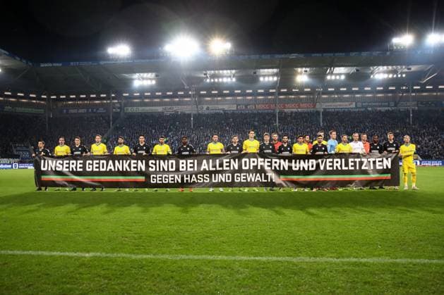24 01 2025, xgox, Soccer 2 Bundesliga, 1 FC Magdeburg Eintracht Braunschweig emspor, v l banner banner, commemoration of the attack on the Christmas market in Magdeburg on 20 12 2024 DFL DFB REGULATIONS PROHIBIT ANY USE OF PHOTOGRAPHS as IMAGE SEQUENCES and or QUASI VIDEO Magdeburg