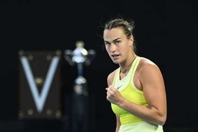 TENNIS AUSTRALIAN OPEN, Aryna Sabalenka of Belarus celebrates with the Daphne Arkhurst Memorial Cup seen in the background during her Women?s final against Madison Keys of the USA during the 2025 Australian Open at Melbourne Park in Melbourne, Saturday, January 25, 2025. ( NO ARCHIVING, EDITORIAL USE ONLY, NO USE IN BOOKS WITHOUT CONSENT MELBOURNE VICTORIA AUSTRALIA  Copyright: xJOELxCARRETTx 20250125117945275090