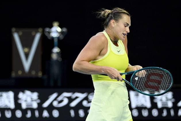 TENNIS AUSTRALIAN OPEN, Aryna Sabalenka of Belarus reacts with the Daphne Arkhurst Memorial Cup seen in the background during her Women?s final against Madison Keys of the USA during the 2025 Australian Open at Melbourne Park in Melbourne, Saturday, January 25, 2025. ( NO ARCHIVING, EDITORIAL USE ONLY, NO USE IN BOOKS WITHOUT CONSENT MELBOURNE VICTORIA AUSTRALIA  Copyright: xJOELxCARRETTx 20250125174050874956