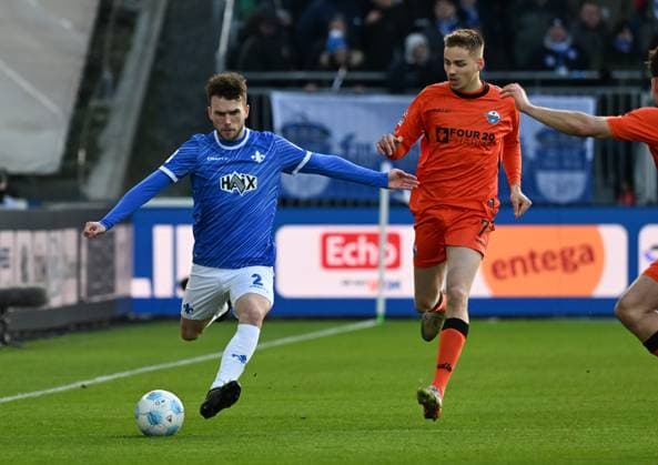 26 01 2025, xsltx, Soccer 2 Bundesliga, SV Darmstadt 98 SC Paderborn 07 emspor, v l Sergio Lopez SV Darmstadt 98 , Filip Bilbija SC Paderborn 07 DFL DFB REGULATIONS PROHIBIT ANY USE OF PHOTOGRAPHS as IMAGE SEQUENCES and or QUASI VIDEO