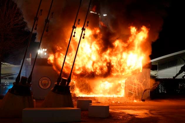Manchester, England, 29th January 2025. A Manchester City club shop catches fire outside the stadium during the UEFA Champions League match at the Etihad Stadium, Manchester. Picture credit should read: Andrew Yates Sportimage EDITORIAL USE ONLY. No use with unauthorised audio, video, data, fixture lists, club league logos or live services. Online in-match use limited to 120 images, no video emulation. No use in betting, games or single club league player publications. SPI_001_AY_MAN_CITY_BRUGGE SPI-3642-0007