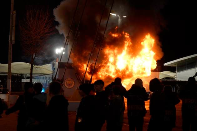 Manchester, England, 29th January 2025. A Manchester City club shop catches fire outside the stadium during the UEFA Champions League match at the Etihad Stadium, Manchester. Picture credit should read: Andrew Yates Sportimage EDITORIAL USE ONLY. No use with unauthorised audio, video, data, fixture lists, club league logos or live services. Online in-match use limited to 120 images, no video emulation. No use in betting, games or single club league player publications. SPI_005_AY_MAN_CITY_BRUGGE SPI-3642-0011