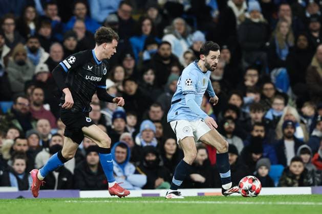 Club s Maxim De Cuyper and Manchester City s Bernardo Silva fight for the ball during a soccer game between English Manchester City and Belgian Club Brugge KV, Wednesday 29 January 2025 in Manchester, United Kingdom, on the eight day (out of 8) of the UEFA Champions League league phase. BRUNOxFAHY  x111412472x