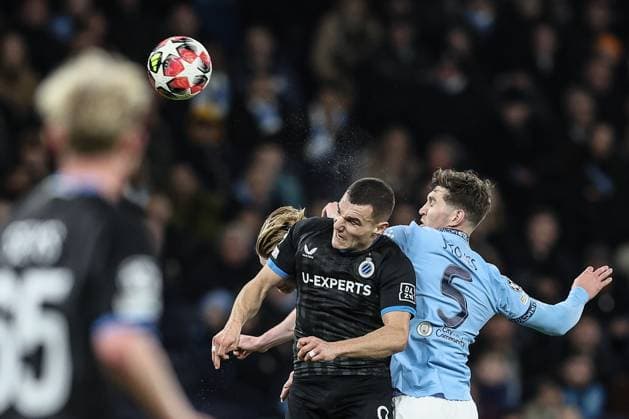 Club s Ferran Jutgla and Manchester City s John Stones fight for the ball during a soccer game between English Manchester City and Belgian Club Brugge KV, Wednesday 29 January 2025 in Manchester, United Kingdom, on the eight day (out of 8) of the UEFA Champions League league phase. BRUNOxFAHY  x111412737x