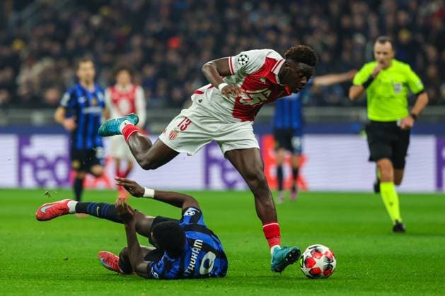 Marcus Thuram of FC Internazionale competes for the ball with Christian Mawissa of AS Monaco FC during UEFA Champions League 2024 25 League Phase - Matchday8 football match between FC Internazionale and AS Monaco FC at San Siro Stadium  Copyright: xFabrizioxCarabelli IPAxSportx xipa-agency.netx xx IPA_53439520 IPA_Agency_IPA53439520