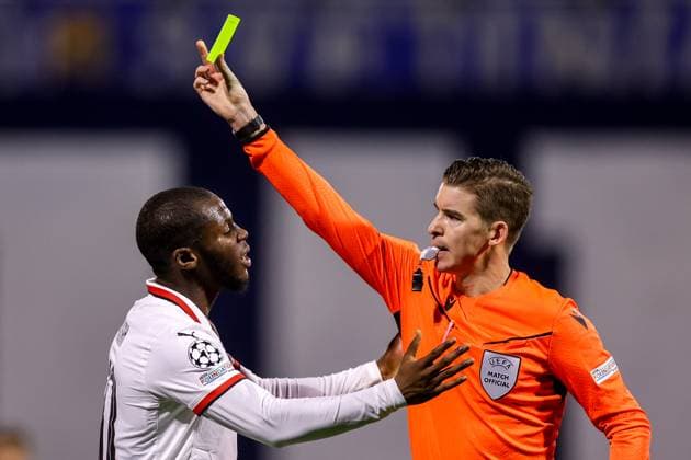 GNK Dinamo v AC Milan - UEFA Champions League 2024 25 League Phase MD8 Referee Francois Letexier showing yellow card to Yunus Musah of AC Milan during the UEFA Champions League 2024 25 League Phase MD8 match between GNK Dinamo and AC Milan at Maksimir Stadium on January 29, 2025. in Zagreb, Croatia.  LukaxStanzl PIXSELL