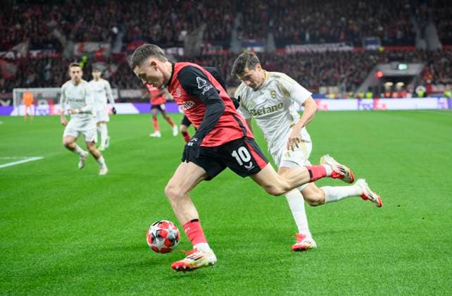 v l Florian WIRTZ LEV , Lukas SADILEK Prague action, duel, Football Champions League, Matchday 8, Bayer 04 Leverkusen LEV Sparta Prague, on 29 01 2025 in Leverkusen Germany UEFA regulations prohibit any use of photographs as image sequences and or quasi video Â