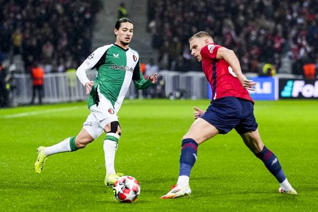 UEFA Champions League: Lille OSC v Feyenoord Lille - Anis Hadj Moussa of Feyenoord, Mitchel Bakker of Lille OSC during the eight and final round of new format of the Champions League 2024 2025. The match is set between Lille OSC and Feyenoord at Stade Pierre-Mauroy on 29 January 2025 in Lille, France. Copyright: xTomxBodex