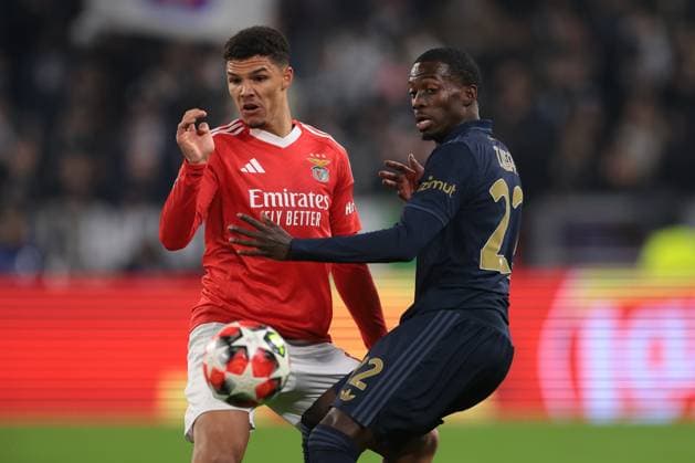 Turin, Italy, 29th January 2025. Alexander Bah of SL Benfica and Timothy Weah of Juventus during the UEFA Champions League match at Allianz Stadium, Turin. Picture credit should read: Jonathan Moscrop Sportimage EDITORIAL USE ONLY. No use with unauthorised audio, video, data, fixture lists, club league logos or live services. Online in-match use limited to 120 images, no video emulation. No use in betting, games or single club league player publications. SPI_008_JM_JUVE_BENFICA_UCL SPI-3635-0008