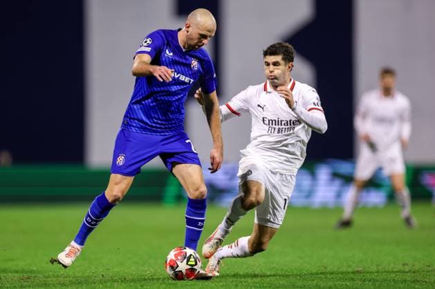 GNK Dinamo v AC Milan - UEFA Champions League 2024 25 League Phase MD8 Josip Misic of Dinamo Zagreb fights for the ball with Christian Pulisic of AC Milan during the UEFA Champions League 2024 25 League Phase MD8 match between GNK Dinamo and AC Milan at Maksimir Stadium on January 29, 2025. in Zagreb, Croatia.  LukaxStanzl PIXSELL