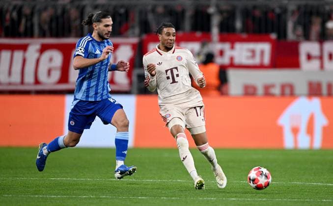 FOOTBALL CHAMPIONS LEAGUE SEASON 2024 2025 Preliminary Round 8 Matchday FC Bayern Muenchen Slovan Bratislava 29 01 2025 Kyriakos Savvidis left, Slovan Bratislava v Michael Olise right, FC Bayern Muenchen