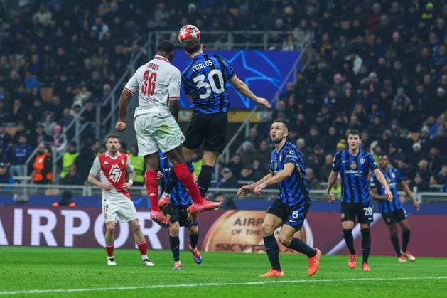 Carlos Augusto of FC Internazionale competes for the ball with Breel Embolo of AS Monaco FC during UEFA Champions League 2024 25 League Phase - Matchday8 football match between FC Internazionale and AS Monaco FC at San Siro Stadium  Copyright: xFabrizioxCarabelli IPAxSportx xipa-agency.netx xx IPA_53442655 IPA_Agency_IPA53442655