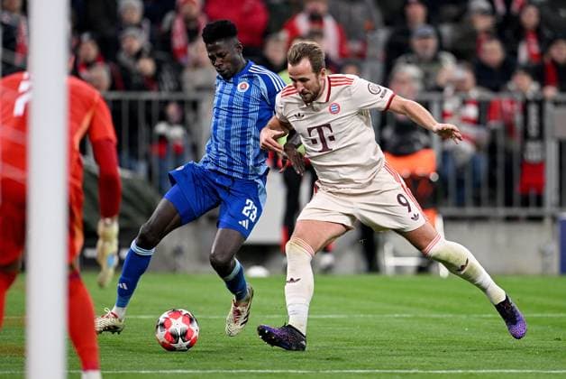 FOOTBALL CHAMPIONS LEAGUE SEASON 2024 2025 Preliminary Round 8 Matchday FC Bayern Muenchen Slovan Bratislava 29 01 2025 Sharani Zuberu left, Slovan Bratislava v Harry Kane right, FC Bayern Muenchen