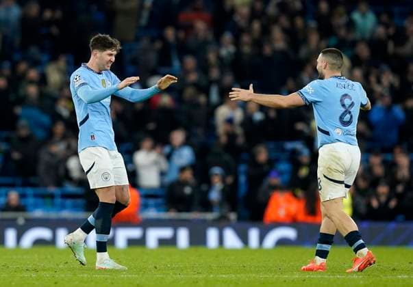 Manchester, England, 29th January 2025. Manchester City™s John Stones celebrates with Manchester City s Mateo Kovacic during the UEFA Champions League match at the Etihad Stadium, Manchester. Picture credit should read: Andrew Yates Sportimage EDITORIAL USE ONLY. No use with unauthorised audio, video, data, fixture lists, club league logos or live services. Online in-match use limited to 120 images, no video emulation. No use in betting, games or single club league player publications. SPI_077_AY_MAN_CITY_BRUGGE SPI-3642-0083