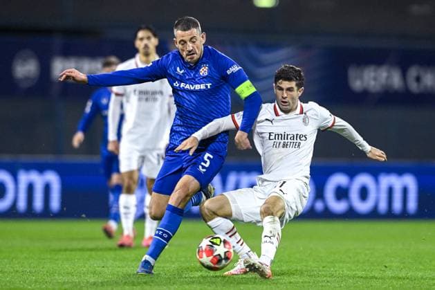 GNK Dinamo v AC Milan - UEFA Champions League 2024 25 League Phase MD8 Arijan Ademi of Dinamo Zagreb competes for the ball with Christian Pulisic of AC Milan during the UEFA Champions League 2024 25 League Phase MD8 match between GNK Dinamo and AC Milan at Maksimir Stadium on January 29, 2025. in Zagreb, Croatia.  MarkoxLukunic PIXSELL