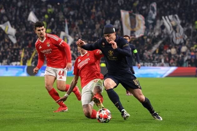 Turin, Italy, 29th January 2025. Tomas Araujo of SL Benfica closes in as Kenan Yildiz of Juventus takes on Angel Di Maria of SL Benfica during the UEFA Champions League match at Allianz Stadium, Turin. Picture credit should read: Jonathan Moscrop Sportimage EDITORIAL USE ONLY. No use with unauthorised audio, video, data, fixture lists, club league logos or live services. Online in-match use limited to 120 images, no video emulation. No use in betting, games or single club league player publications. SPI_037_JM_JUVE_BENFICA_UCL SPI-3635-0037