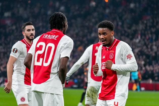 2025-01-30 AFC Ajax v Galatasaray - UEFA Europa League 2024 25 League Phase MD8 AMSTERDAM, NETHERLANDS - JANUARY 30: Bertrand Traore of AFC Ajax celebrates after scoring his sides first goal with Jorrel Hato of AFC Ajax during the UEFA Europa League 2024 25 League Phase MD8 match between AFC Ajax and Galatasaray at Johan Cruijff ArenA on January 30, 2025 in Amsterdam, Netherlands. Amsterdam Johan Cruijff ArenA Netherlands Content not available for redistribution in The Netherlands directly or indirectly through any third parties. Copyright: xGabrielxCalvinoxAlonsox