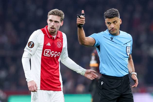 2025-01-30 AFC Ajax v Galatasaray - UEFA Europa League 2024 25 League Phase MD8 AMSTERDAM, NETHERLANDS - JANUARY 30: Kenneth Taylor of AFC Ajax talking with Referee Jesus Gil Manzano gestures during the UEFA Europa League 2024 25 League Phase MD8 match between AFC Ajax and Galatasaray at Johan Cruijff ArenA on January 30, 2025 in Amsterdam, Netherlands. Amsterdam Johan Cruijff ArenA Netherlands Content not available for redistribution in The Netherlands directly or indirectly through any third parties. Copyright: xBenxGalx