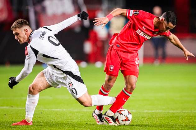 2025-01-30 FC Twente v Besiktas JK - UEFA Europa League 2024 25 League Phase MD8 ENSCHEDE, NETHERLANDS - JANUARY 30: Anass Salah-Eddine of FC Twente battles for possession with Semih Kilicsoy of Besiktas JK during the UEFA Europa League 2024 25 League Phase MD8 match between FC Twente and Besiktas JK at De Grolsch Veste on January 30, 2025 in Enschede, Netherlands. Enschede De Grolsch Veste Netherlands Content not available for redistribution in The Netherlands directly or indirectly through any third parties. Copyright: xPeterxLousx