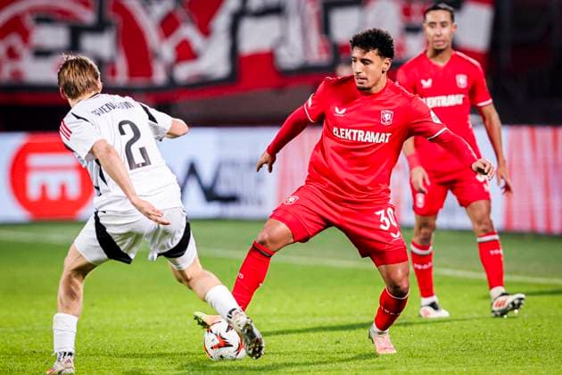 2025-01-30 FC Twente v Besiktas JK - UEFA Europa League 2024 25 League Phase MD8 ENSCHEDE, NETHERLANDS - JANUARY 30: Sayf Ltaief of FC Twente battles for possession with Jonas Svensson of Besiktas JK during the UEFA Europa League 2024 25 League Phase MD8 match between FC Twente and Besiktas JK at De Grolsch Veste on January 30, 2025 in Enschede, Netherlands. Enschede De Grolsch Veste Netherlands Content not available for redistribution in The Netherlands directly or indirectly through any third parties. Copyright: xPeterxLousx