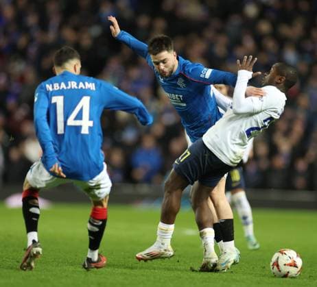 Nicolas Raskin of Rangers battles for the ball with Noah Sadiki of Union Saint-Gilloise during the Europa League group phase match at Ibrox Stadium, Glasgow. Rangers v Union Saint-Gilloise, Europa League, Football, Ibrox Stadium, Glasgow, Scotland, UK - 30 Jan 2025 EDITORIAL USE ONLY No use with unauthorised audio, video, data, fixture lists, club league logos or live services. Online in-match use limited to 120 images, no video emulation. No use in betting, games or single club league player publications. Copyright: xO Rourke RangersxFC Shutterstockx 15126401ci