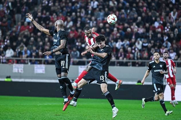 CALCIO - UEFA Europa League - Olympiacos vs Qarabag 9 Ayoub El Kaabi of Olympiacos FC competing with 13 Bahlul Mustafazade of Qarabag during the Europa League, Matchday 8 match between Olympiacos FC and Qarabag at Georgios Karaiskakis Stadium in Piraeus, Greece, on January 30, 2025. Piraeus Greece  Copyright: xIPAxSport ABACAx