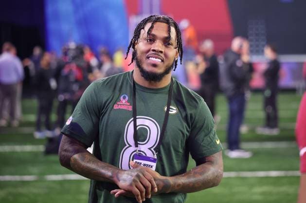 ORLANDO, FL - JANUARY 30: Green Bay Packers Josh Jacobs laughs with teammate before the Pro Bowl Skills Showdown on Thursday, January 30, 2025 at UCF in Orlando, FL. (Photo by Peter Joneleit Icon Sportswire) NFL, American Football Herren, USA JAN 30 Pro Bowl Thursday Skills Showdown EDITORIAL USE ONLY Icon250130009