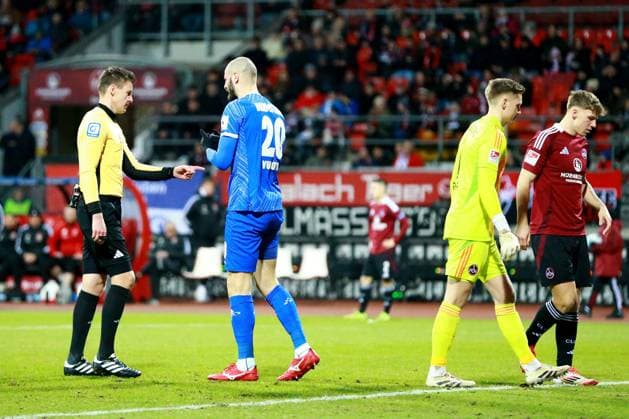 31 01 2025, xrekx, Soccer 2 Bundesliga, 1 FC Nuernberg SV Darmstadt 98 v l Referee Referee Daniel Siebert Aleksandar Vukotic SV Darmstadt 98 DFL DFB REGULATIONS PROHIBIT ANY USE OF PHOTOGRAPHS as IMAGE SEQUENCES and or QUASI VIDEO Nuernberg