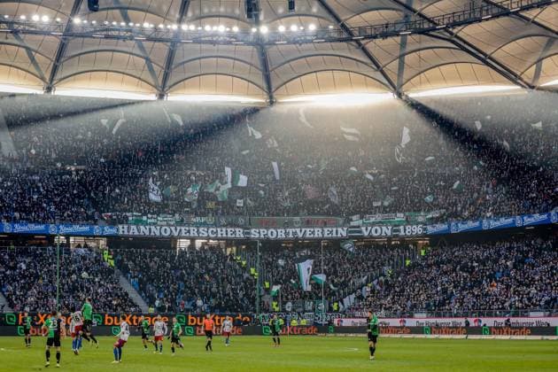 Match scene Banner Hannoverscher Sportverein von 1896 backlight sunlight fog HSV Hannover Germany , Hamburg , Volksparkstadion , Football , 2 Bundesliga , Hamburger SV Hannover 96