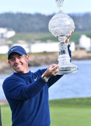 February 2, 2025, Pebble Beach, Ca, USA: Rory McIlroy is seen holding the Winners Trophy on the 18th hole Green after the final round of the AT&T Pebble Beach Pro-Am 2025 at Pebble Beach Golf Links on February 02, 2025 in Pebble Beach, California. Photo: Casey Flanigan imageSPACE Pebble Beach USA - ZUMAi237 20250202_zsa_i237_042 Copyright: xFlanigan Imagespacex