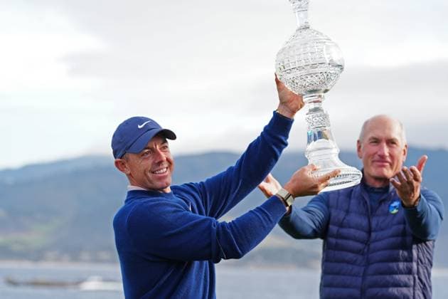 PEBBLE BEACH, CA - FEBRUARY 02: PGA, Golf Herren golfer Rory McIlroy is presented the trophy by AT&T CEO John Stankey after winning the AT&T Pebble Beach Pro AM on February 2, 2025, at Pebble Beach Golf Links in Pebble Beach, California. (Photo by Brian Spurlock Icon Sportswire) GOLF: FEB 02 PGA AT&T Pebble Beach Pro-Am EDITORIAL USE ONLY Icon25020264