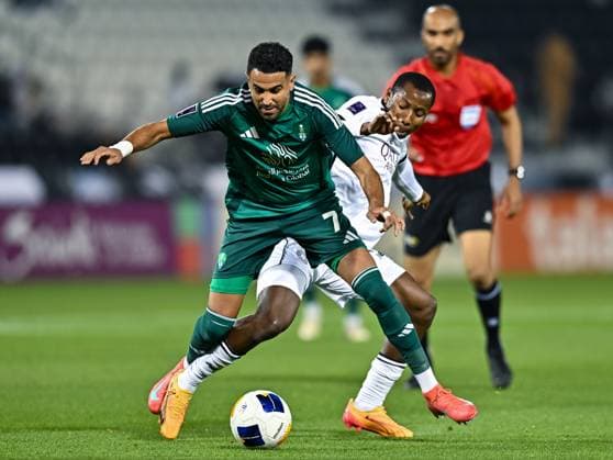 AFC CHAMPIONS LEAGUE ELITE, AL SADD SC (QTR) v AL AHLI SAUDI FC (KSA) Mohamed Camara (R) of Al Sadd SC and Riyad Mahrez of Al Ahli SFC in action during the AFC Champions League elite west football match between Qatar s Al Sadd SC and Saudi Arabia s Al Ahli SFC at Jassim Bin Hamad Stadium in Doha, Qatar, on February 03, 2024. DOHA Qatar Copyright: xNAUSHADx
