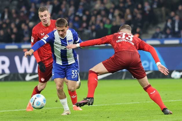 2 Soccer Bundesliga Hertha BSC 1 FC Kaiserslautern Micha Karbownik Hertha BSC Berlin 33 taking a shot on goal against Jan Elvedi Kaiserslautern 33 , during the match in the 2 Soccer Bundesliga Hertha BSC 1 FC Kaiserslautern in Berlin, Olympiastadion, on 08 02 2025 DFB regulations prohibit any use of photographs as image sequences and or quasi video Copyright: xBEAUTIFULxSPORTS Frankex