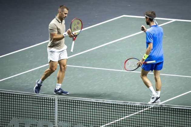 ROTTERDAM - Sander Gille (BEL) and Jan Zielinski (POL) in action against Simone Bolelli (ITA) and Andrea Vavassori (ITA) during the final doubles match on the seventh day of the ABN AMRO Open tennis tournament in Ahoy. ANP SANDER KING ABN AMRO Open - Day Seven 2025 xVIxANPxSportx xxANPxIVx 519515889 originalFilename: 519515889.jpg