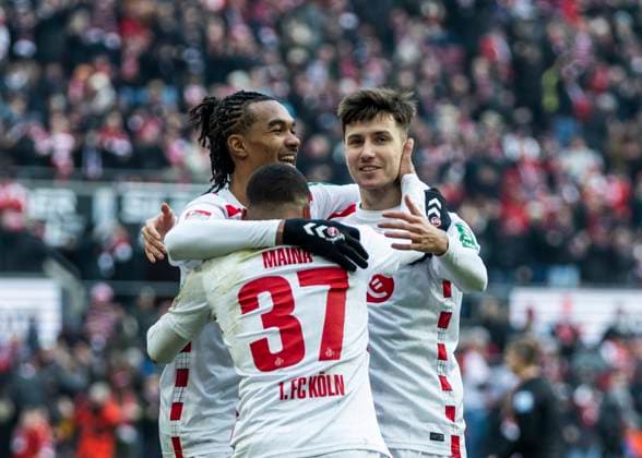 Köln, RheinEnergieStadion, 07 01 2025 Damion Downs of Koeln M celebrates scoring the 1 0 goal with Denis Huseinbasic of Koeln R and Linton Maina of Koeln during the 2 Bundesliga 1 FC Köln vs FC Schalke 04
