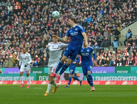 09 02 2025, xjpx, Soccer 2 Bundesliga, 1 FC Koeln FC Schalke 04 v l Janik Bachmann Schalke 04 skips Denis Huseinbasic Koeln DFL DFB REGULATIONS PROHIBIT ANY USE OF PHOTOGRAPHS as IMAGE SEQUENCES and or QUASI VIDEO Koeln