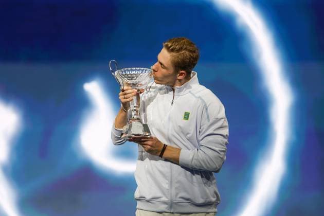 FRISCO, TX - FEBRUARY 09: Denis Shapovalov (CAN) kisses the trophy after winning the Dallas Open on February 9, 2025 at Ford Center at The Star in Frisco, TX. (Photo by George Walker Icon Sportswire) TENNIS: FEB 09 Dallas Open EDITORIAL USE ONLY Icon250209004