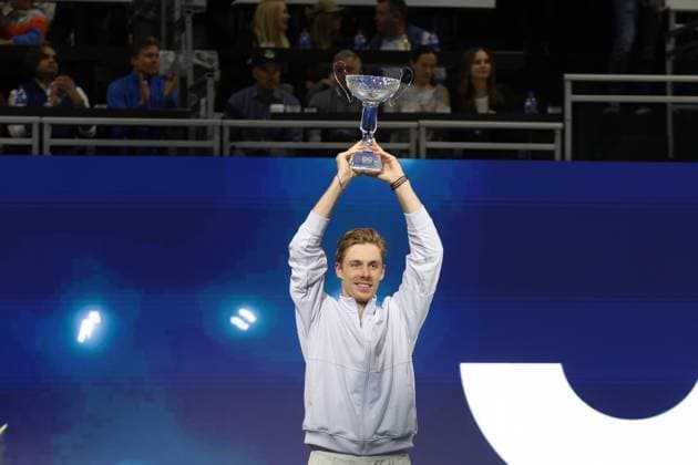 FRISCO, TX - FEBRUARY 09: Denis Shapovalov (CAN) raises the trophy after winning the Dallas Open on February 9, 2025 at Ford Center at The Star in Frisco, TX. (Photo by George Walker Icon Sportswire) TENNIS: FEB 09 Dallas Open EDITORIAL USE ONLY Icon250209005